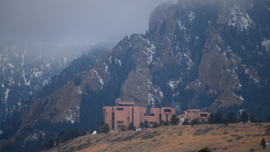 Snow dusts the mountains around the Mesa Laboratory of the Center for Atmospheric Research in Boulder, Colo.