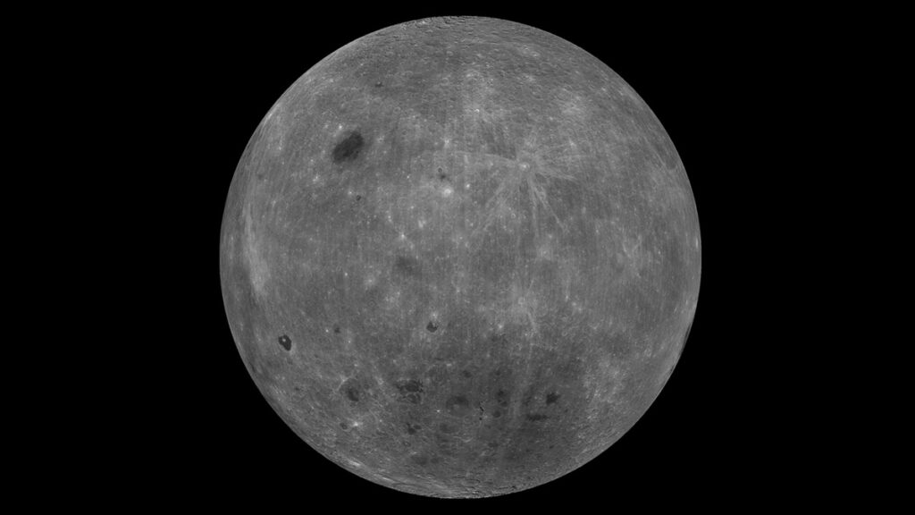 Composite image of the farside of the Moon, a gray surface heavily marked with craters.