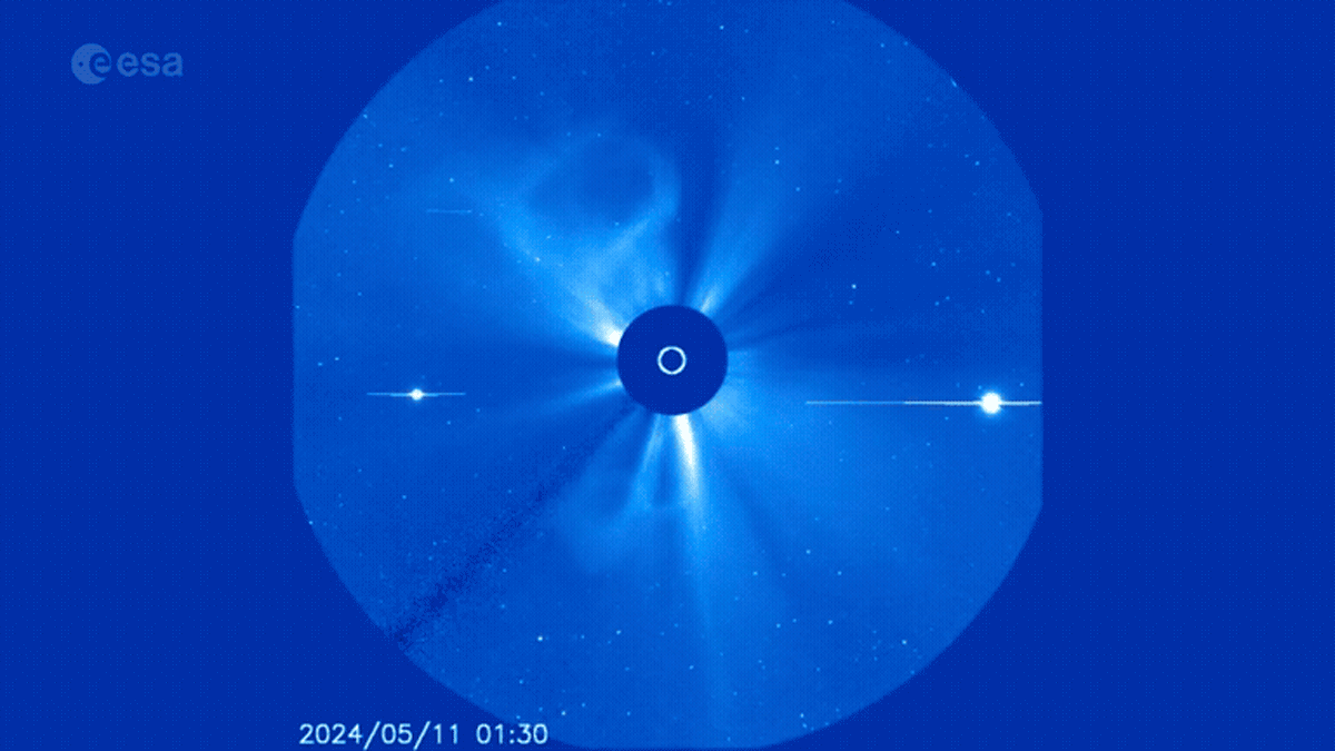 A video shows a blue circle against a darker blue background. Within the circle, waves of pale blue billow out from the center and create static throughout the circle.