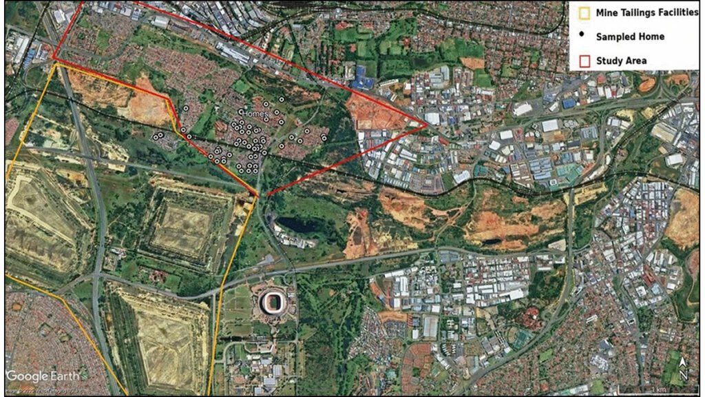 A Google Earth image shows an area of Johannesburg, South Africa, from above. An area with mine tailings is outlined in yellow. Adjacent, a residential area is outlined in red. Black-and-white dots mark the sites of homes where the researchers collected samples.