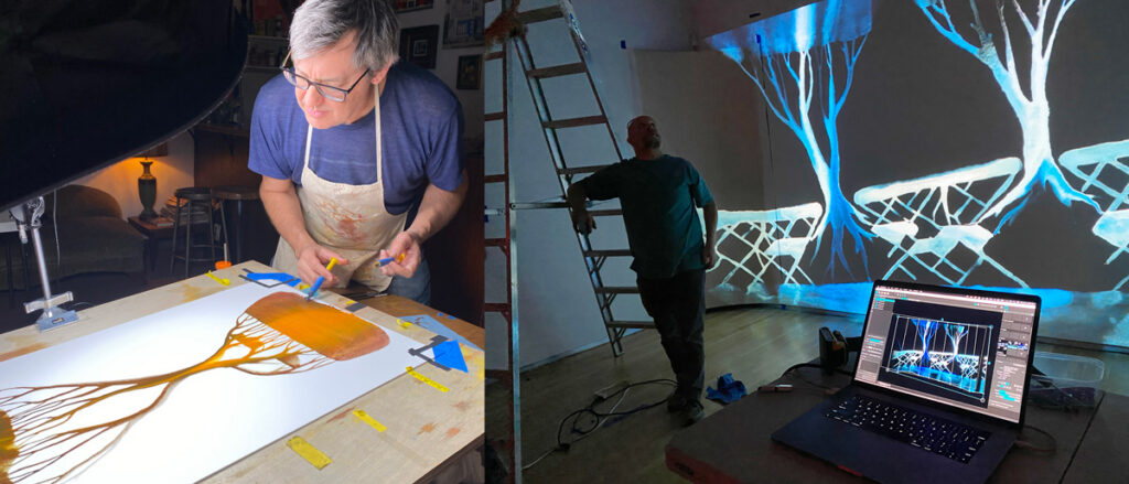 At left, a man leans over and works on a painting of a stylized tree. At right, a man leans against a ladder in a darkened museum space. In the foreground is an open laptop computer; an art exhibit is projected on the wall behind him.