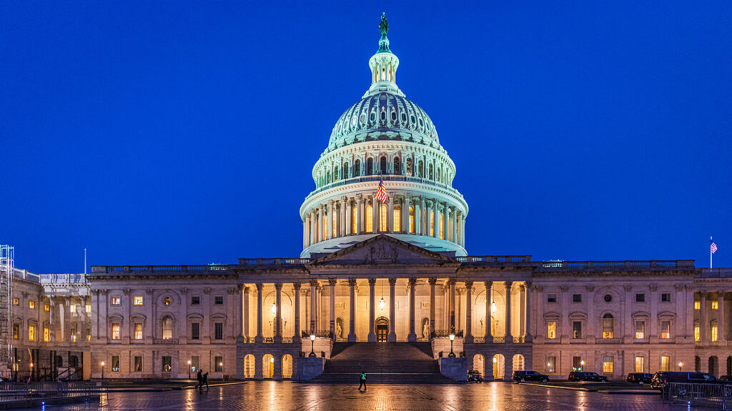 The U.S. capitol building seen at night.