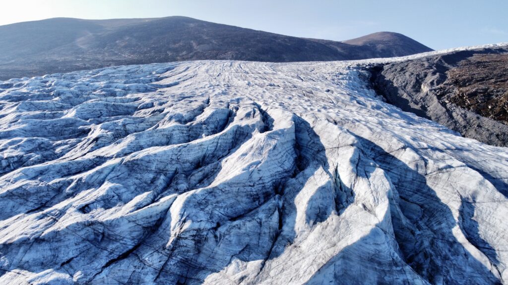 Ridges in the Greenland Ice Sheet tell a story of movement and melt. Credit: Henry C. Henson