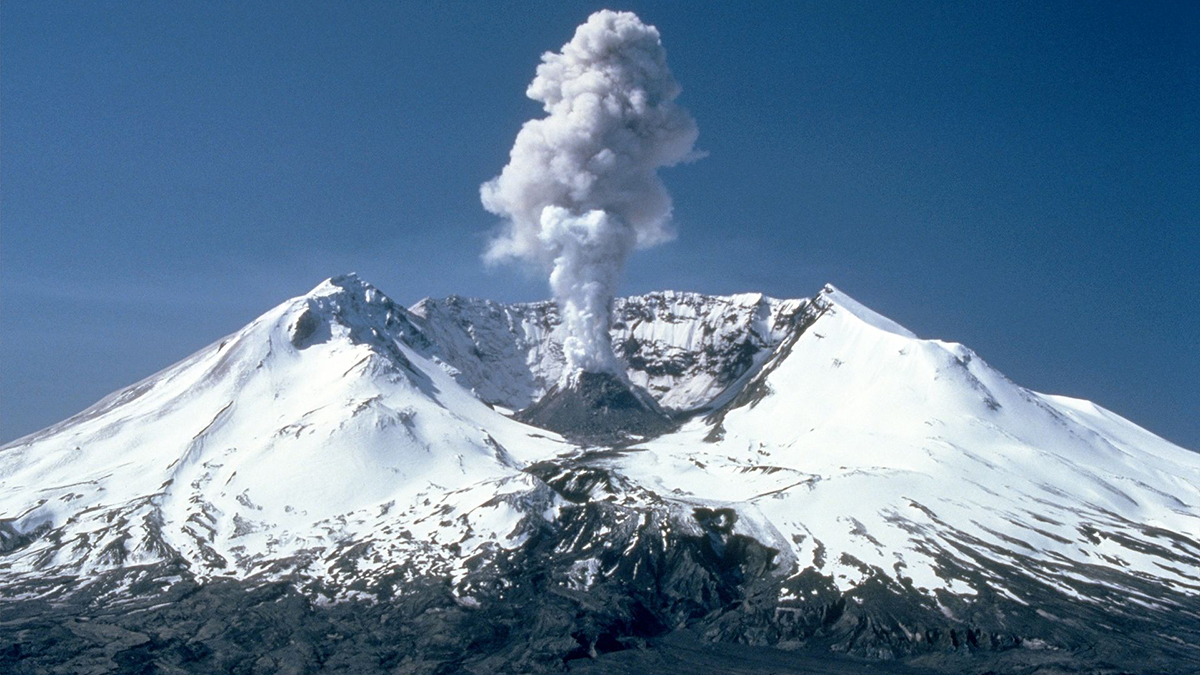 Photo of a volcano erupting.