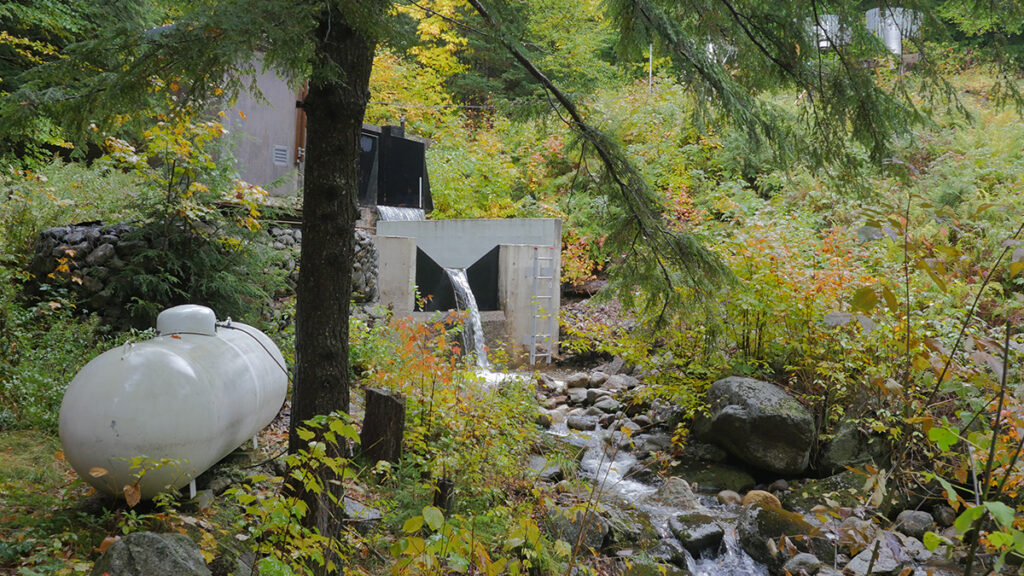 Concrete stream weir in a forest channel measuring water flow at Hubbard Brook Experimental Forest, N.H.