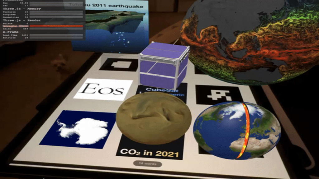 Three-dimensional models of several augmented reality objects—including a projection of earthquake data, a cubesat, ocean currents projected on a globe, a cutaway view of Earth’s interior, atmospheric carbon dioxide movement projected on a globe, and Antarctic topography—are seen here.