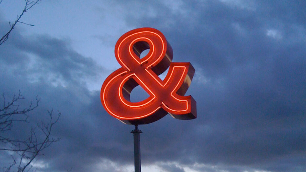 A red ampersand sign