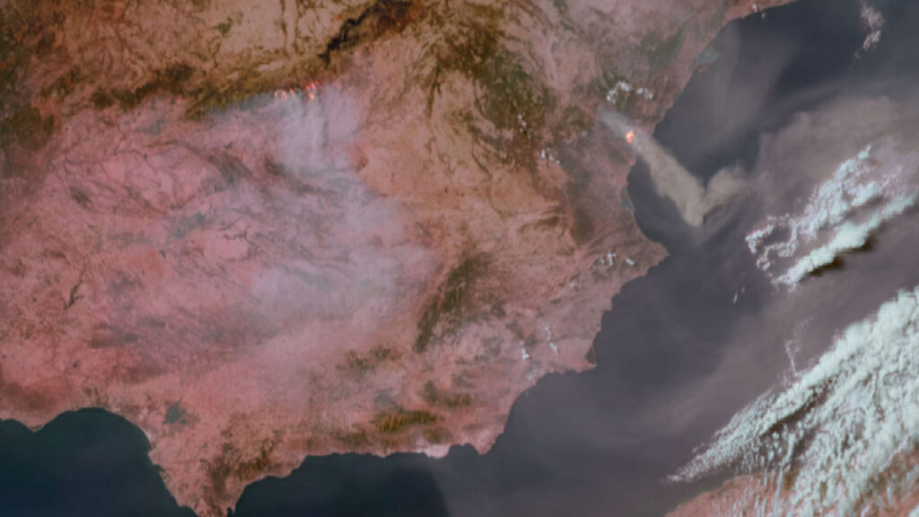 A satellite image shows smoke and fire rising from central Spain.