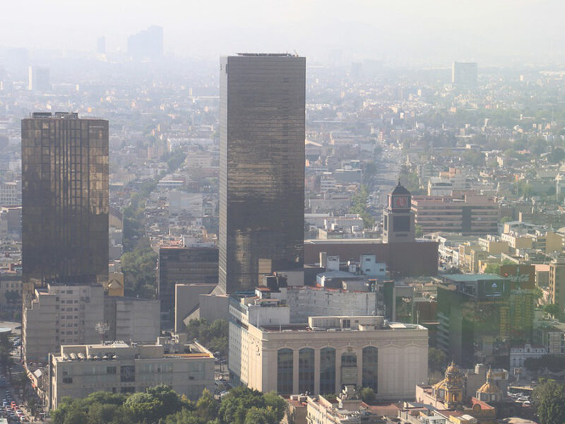 The Ozone Paradox: A Growing Cost of a Warmer Atmosphere