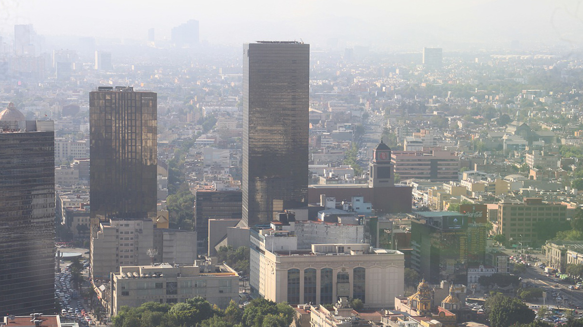 Haze hovers over the skyline of part of Mexico City.
