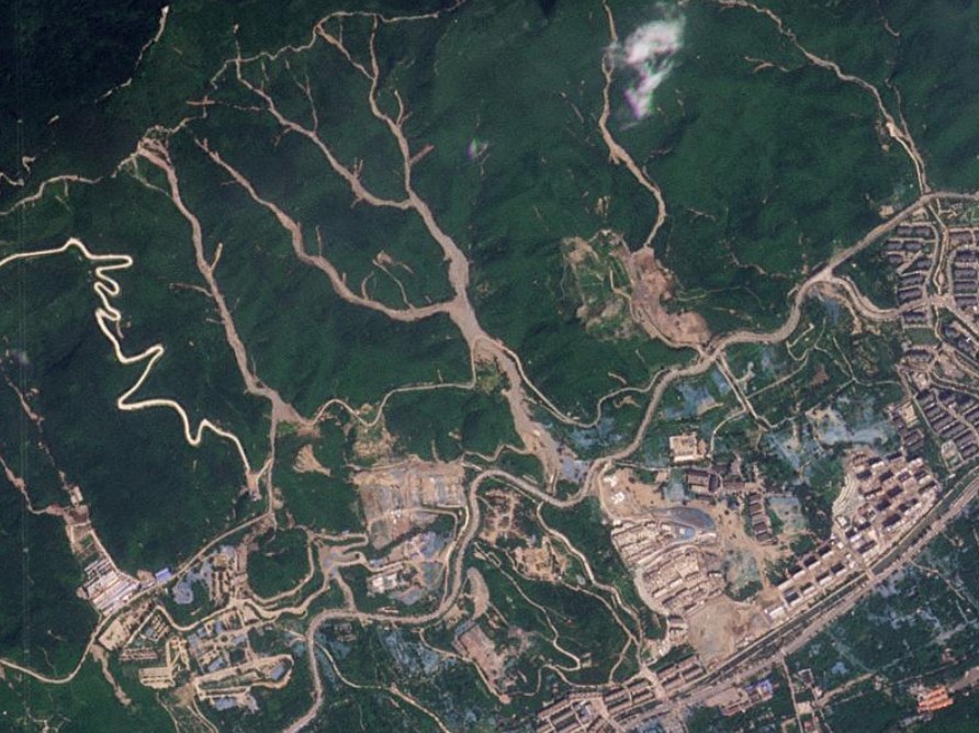 Satellite image of a part of northern China after Typhoon Doksuri showing debris flows in populated areas. Image copyright Planet Labs, captured on 16 August 2023, used with permission.