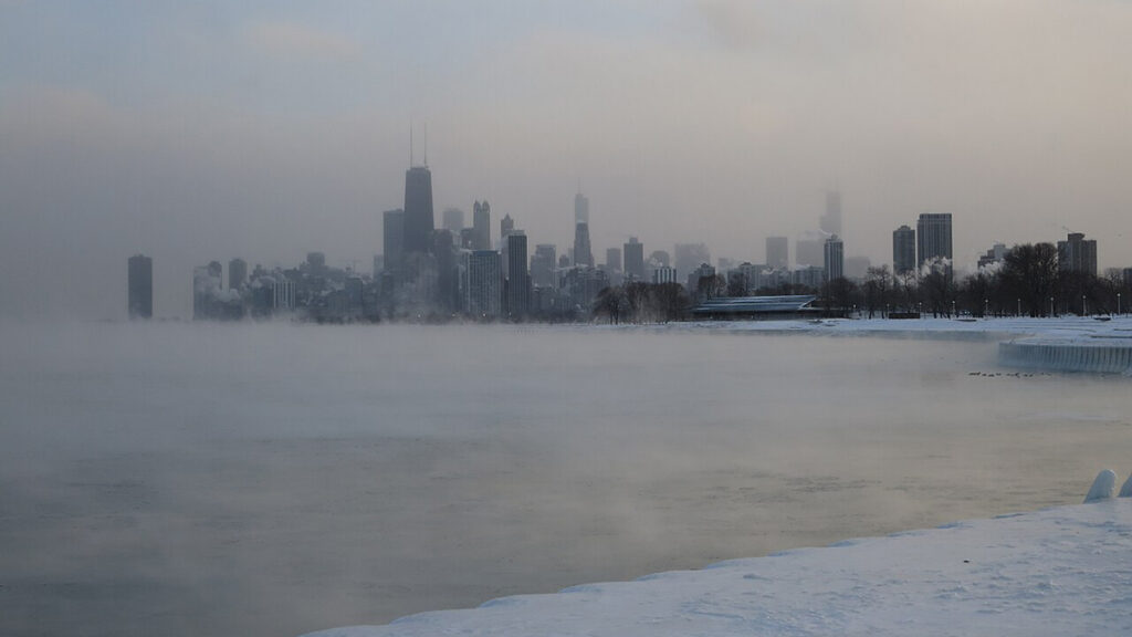 The Chicago skyline with Lake Michigan in the foreground on a cold day